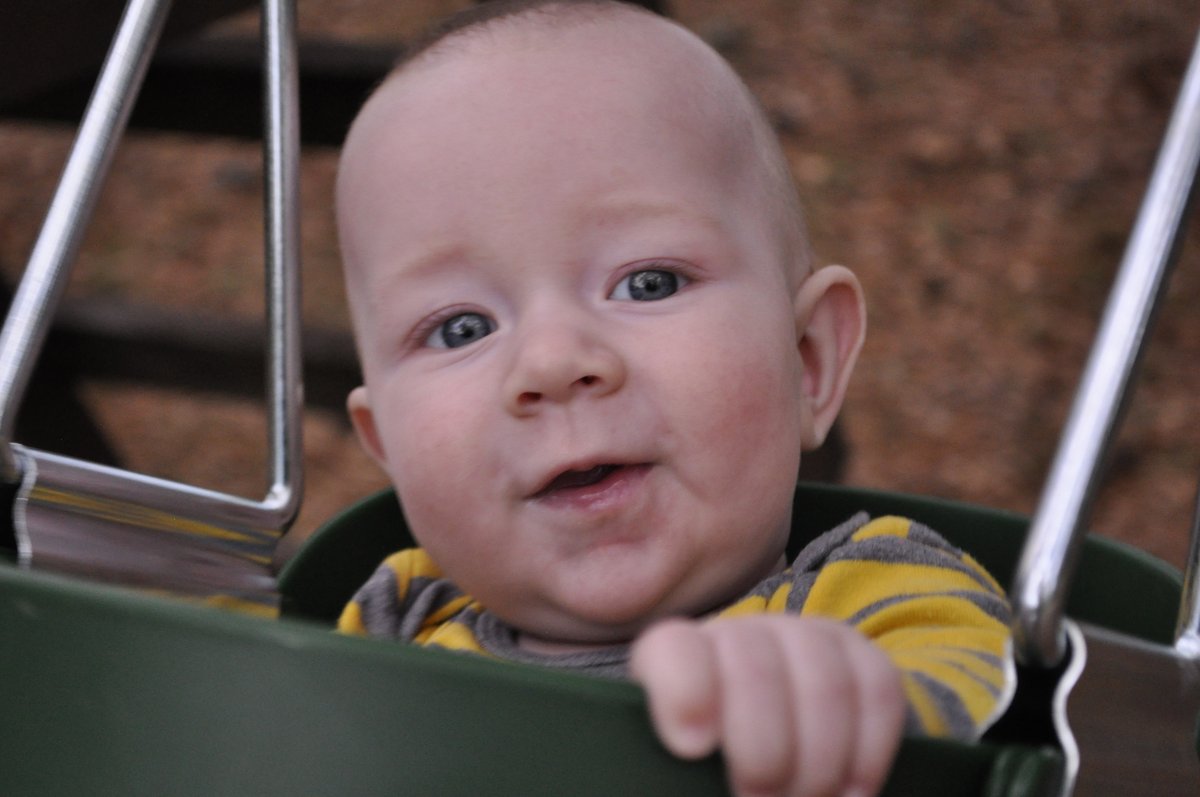 Ezra swinging at Grandpa Jim's